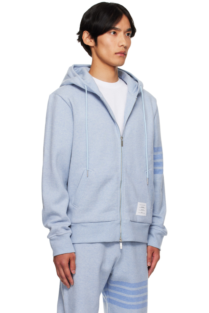 Stretch cotton piqué hoodie.

· Drawstring at hood
· Two-way zip closure
· Logo patch at kangaroo pocket
· Rib-knit hem and cuffs
· Dropped shoulders
· Intarsia stripes at sleeve
· Tricolor grosgrain flag at back collar

Supplier color: Light Blue