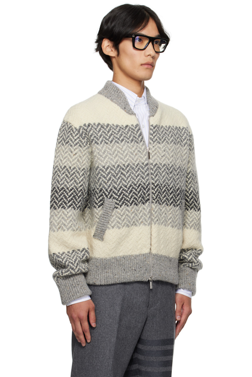 Brushed knit wool- and mohair-blend sweater.

· Jacquard stripes and herringbone pattern throughout
· Rib-knit stand collar, hem, and cuffs
· Two-way zip closure
· Welt pockets
· Tricolor grosgrain flag at back collar

Supplier color: Tonal grey