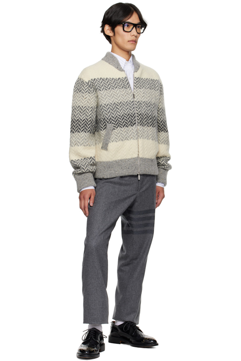 Brushed knit wool- and mohair-blend sweater.

· Jacquard stripes and herringbone pattern throughout
· Rib-knit stand collar, hem, and cuffs
· Two-way zip closure
· Welt pockets
· Tricolor grosgrain flag at back collar

Supplier color: Tonal grey