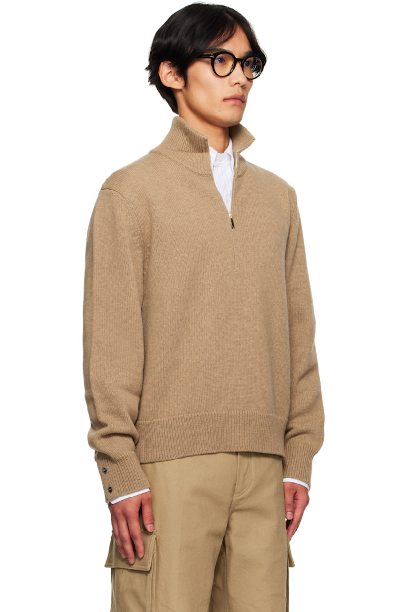 Knit virgin merino wool sweater.

· Rib-knit mock neck, hem, and cuffs
· Half-zip closure
· Button vent with tricolor trim at cuffs
· Tricolor grosgrain flag at back collar
· Intarsia graphics at back

Supplier color: Med brown