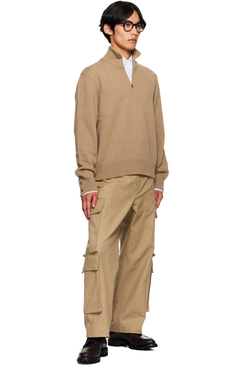 Knit virgin merino wool sweater.

· Rib-knit mock neck, hem, and cuffs
· Half-zip closure
· Button vent with tricolor trim at cuffs
· Tricolor grosgrain flag at back collar
· Intarsia graphics at back

Supplier color: Med brown