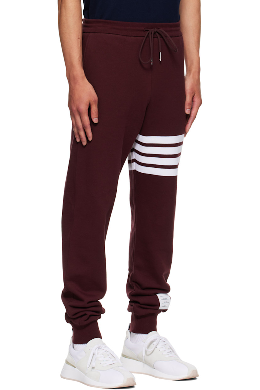 Cotton French terry sweatpants.

· Drawstring at elasticized waistband
· Three-pocket styling
· Intarsia stripes at leg
· Logo patch at lower leg
· Rib-knit cuffs
· Tricolor grosgrain flag at back waistband

Supplier color: Burgundy