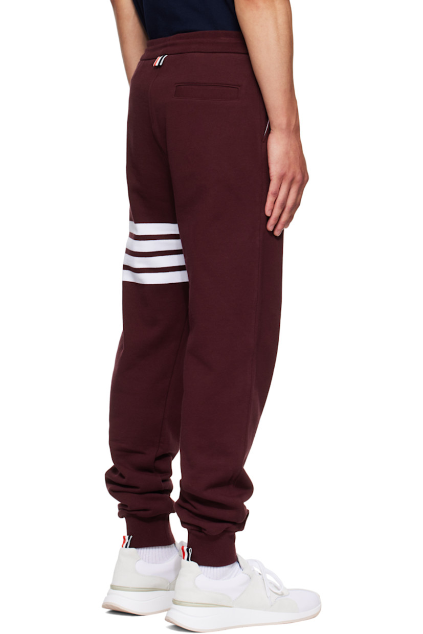 Cotton French terry sweatpants.

· Drawstring at elasticized waistband
· Three-pocket styling
· Intarsia stripes at leg
· Logo patch at lower leg
· Rib-knit cuffs
· Tricolor grosgrain flag at back waistband

Supplier color: Burgundy