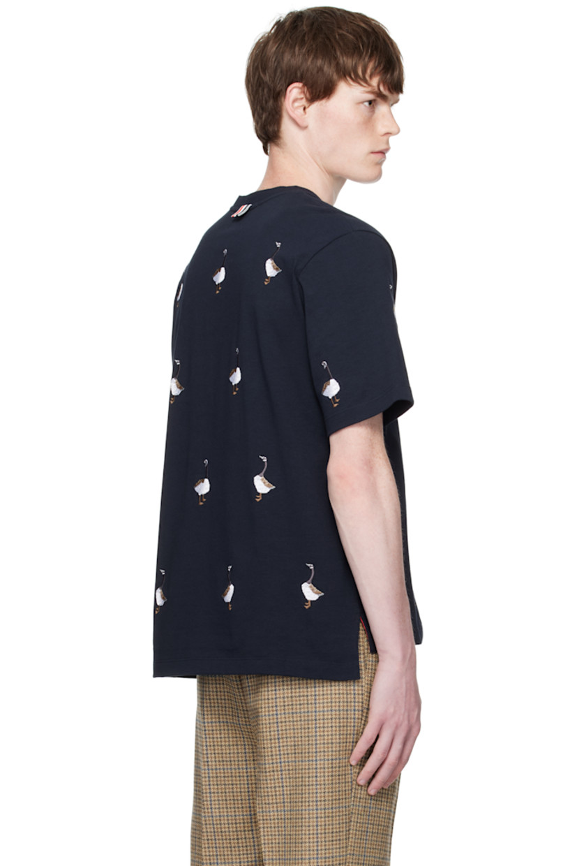Cotton jersey T-shirt.

· Graphic pattern embroidered throughout
· Rib-knit crewneck
· Logo patch at front hem
· Vented side seams
· Tricolor grosgrain flag at back collar

Supplier color: Navy