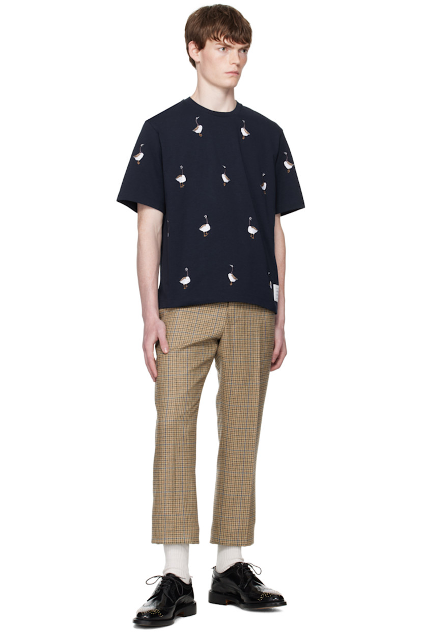 Cotton jersey T-shirt.

· Graphic pattern embroidered throughout
· Rib-knit crewneck
· Logo patch at front hem
· Vented side seams
· Tricolor grosgrain flag at back collar

Supplier color: Navy