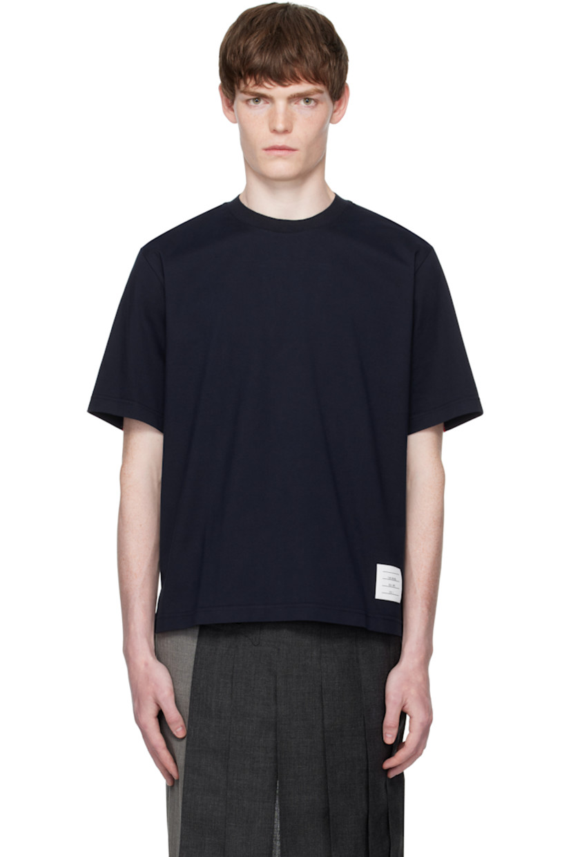 Cotton jersey T-shirt.

· Rib-knit crewneck
· Logo patch at front hem
· Vented side seams
· Tricolor grosgrain flag at back collar
· Knit tricolor trim at back yoke

Supplier color: Navy
