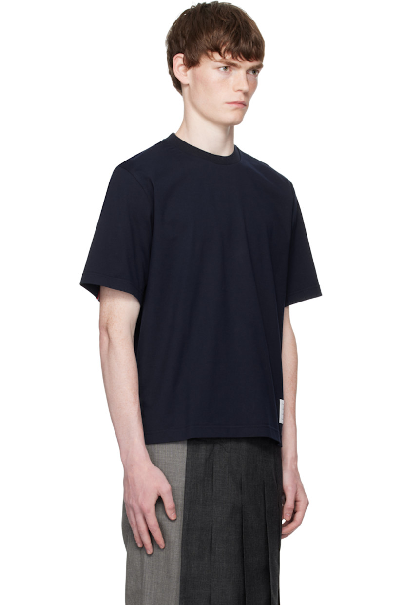 Cotton jersey T-shirt.

· Rib-knit crewneck
· Logo patch at front hem
· Vented side seams
· Tricolor grosgrain flag at back collar
· Knit tricolor trim at back yoke

Supplier color: Navy