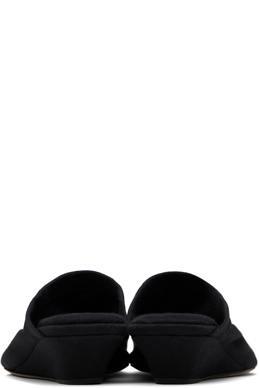 Cotton jersey mules in black. 

· Open almond toe
· Logo patch at padded footbed
· Covered wedge heel 
· Calfskin nubuck sole with rubber injection
· Heel: H1.25"

Supplier color: Black