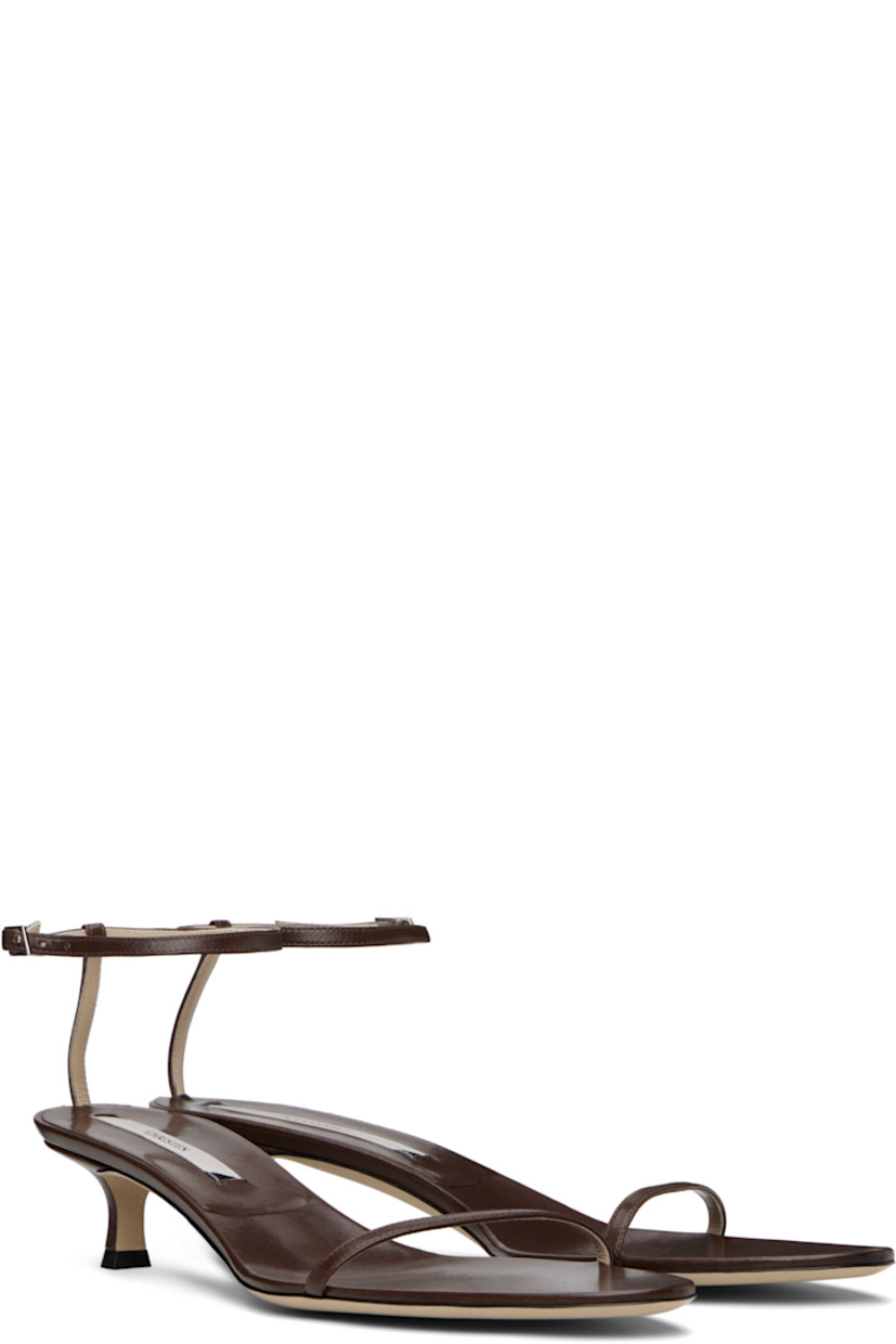 Grained lambskin heeled sandals in brown.

· Open almond toe
· Pin-buckle ankle strap
· Logo patch at footbed
· Covered kitten heel with rubber injection
· Grained calfskin sole
· Heel: H1.75"

Supplier color: Forest brown