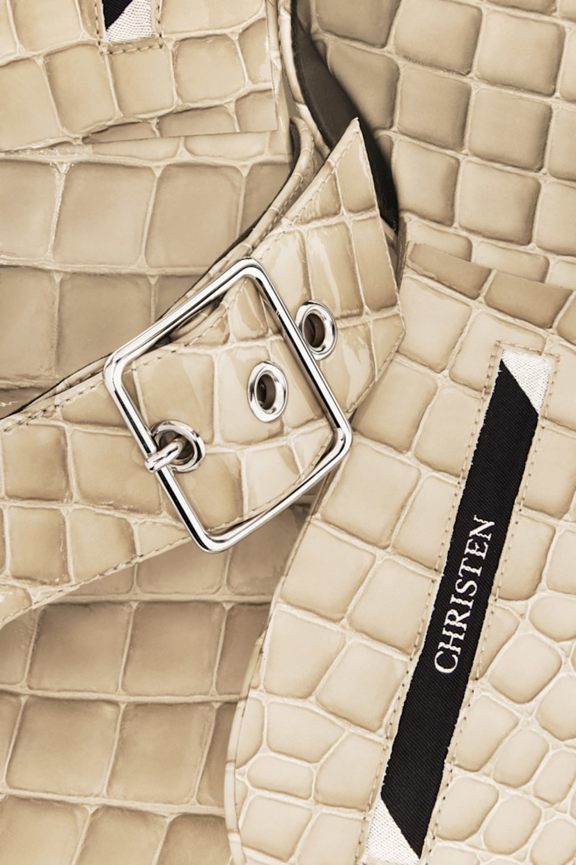 Snake-embossed patent calfskin heeled sandals in beige.

· Open square toe
· Pin-buckle thong-style strap
· Inset logo patch at footbed
· Grained kidskin lining
· Kitten heel with rubber injection 
· Calfskin nubuck sole with rubber injection
· Heel: H1.5"

Available exclusively at SSENSE.

Supplier color: Travertino