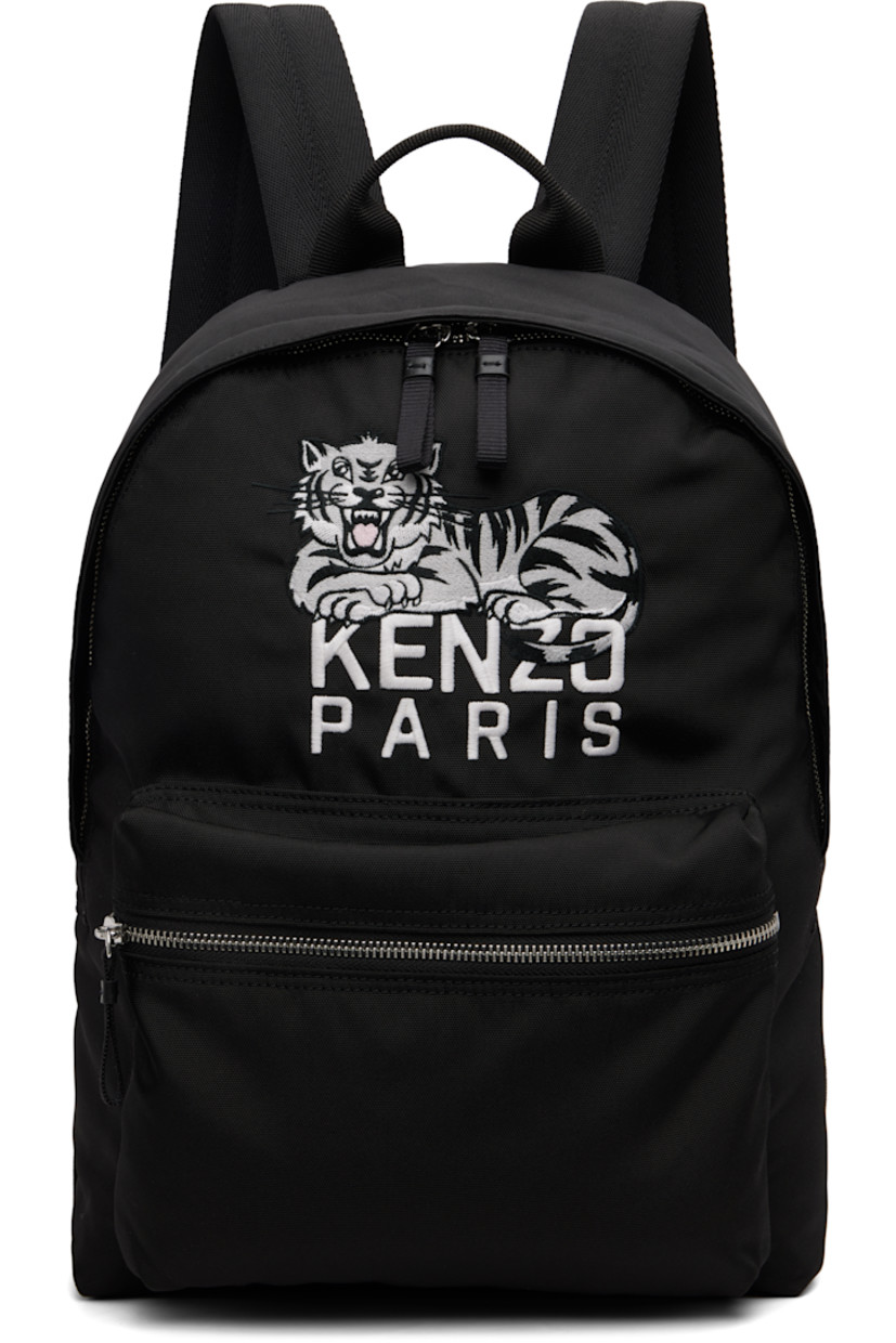 Canvas backpack.

· Fixed carry handle
· Adjustable padded shoulder straps
· Embroidered logo graphic and zip pocket at face
· Two-way zip closure
· Patch pocket at interior
· Twill lining
· H16" x W15" x D5.5"

Supplier color: Black