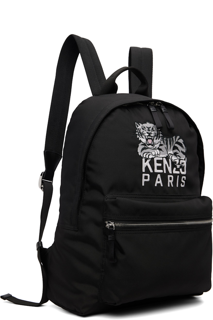 Canvas backpack.

· Fixed carry handle
· Adjustable padded shoulder straps
· Embroidered logo graphic and zip pocket at face
· Two-way zip closure
· Patch pocket at interior
· Twill lining
· H16" x W15" x D5.5"

Supplier color: Black