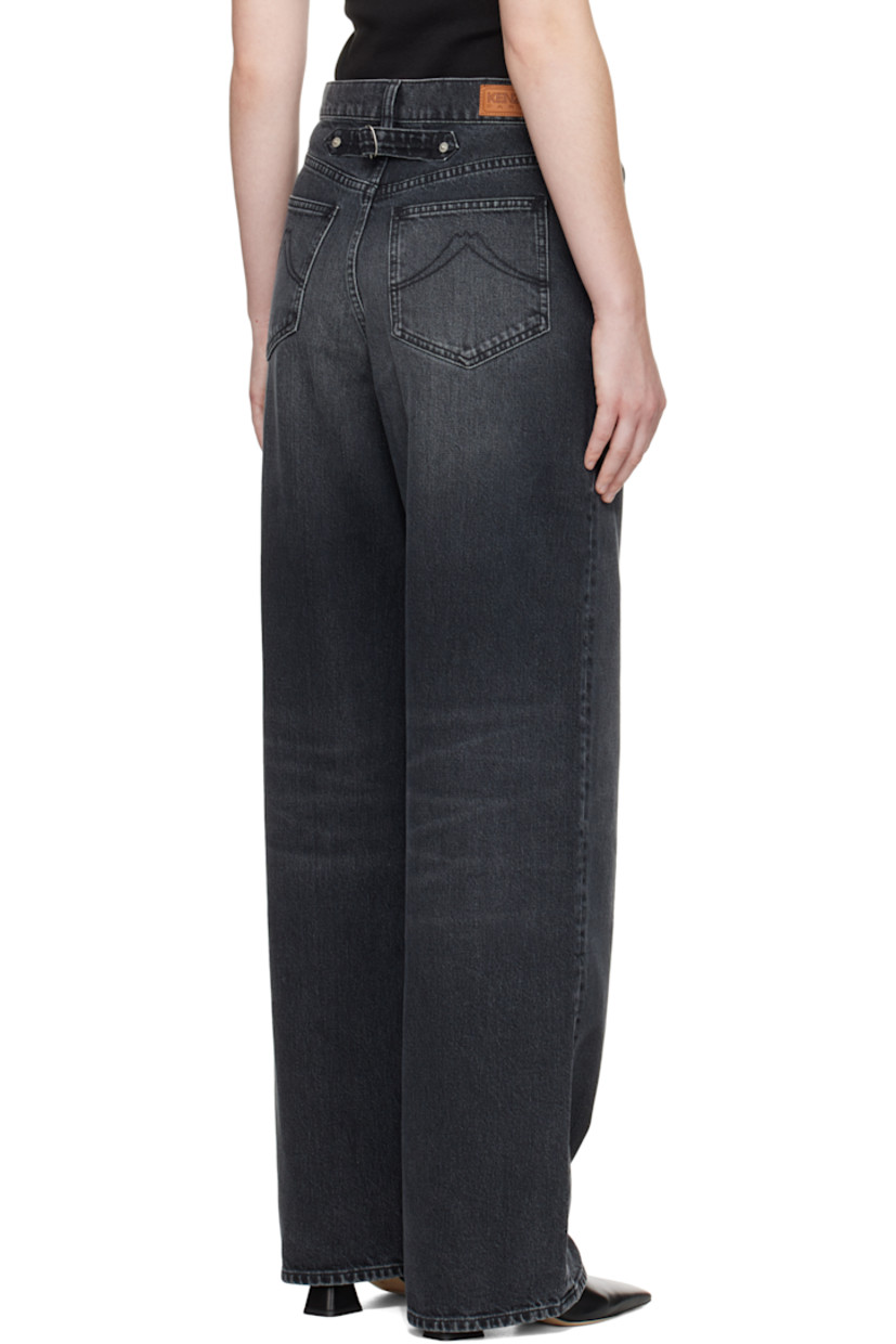 Stretch denim jeans. 

· Stonewashed
· Fading and whiskering throughout 
· Belt loops
· Five-pocket styling
· Zip fly 
· Logo patch at back waistband
· Cinch tab at back waist

Part of the Kenzo x Futura 2000 collaboration. 

Supplier color: Medium stone black denim