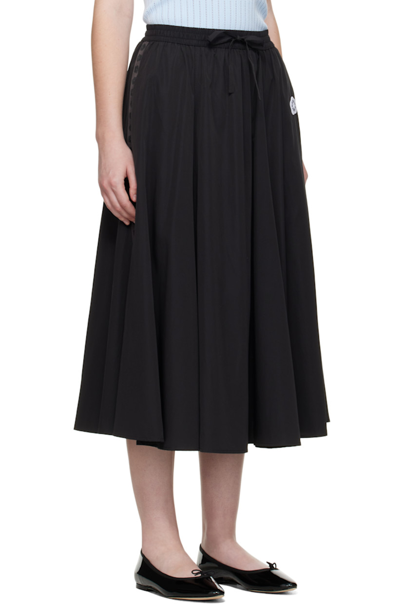 Cotton-blend satin midi skirt. 

· Drawstring at elasticized waistband
· Two-pocket styling
· Embroidered logo patch at waist
· Logo-woven twill trim at side seams

Supplier color: Black