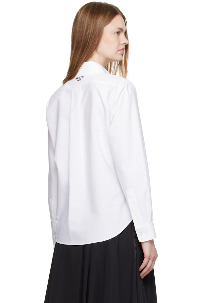 Cotton oxford cloth shirt. 

· Button-down spread collar 
· Button closure
· Embroidered logo at chest
· Shirttail hem
· Buttoned barrel cuffs
· Logo embroidered at back collar 
· Box pleat at back yoke 

Supplier color: White