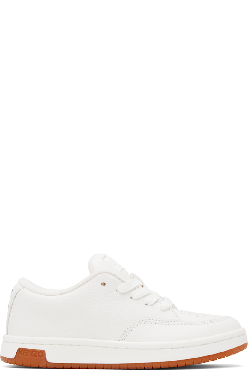Low-top grained leather sneakers.

· Perforated detailing at toe and inner side
· Lace-up closure
· Rubberized logo patch at padded tongue
· Padded collar
· Logo appliqué at heel tab
· Terrycloth lining
· Treaded rubber sole
· Includes alternate laces in blue

Supplier color: Off white