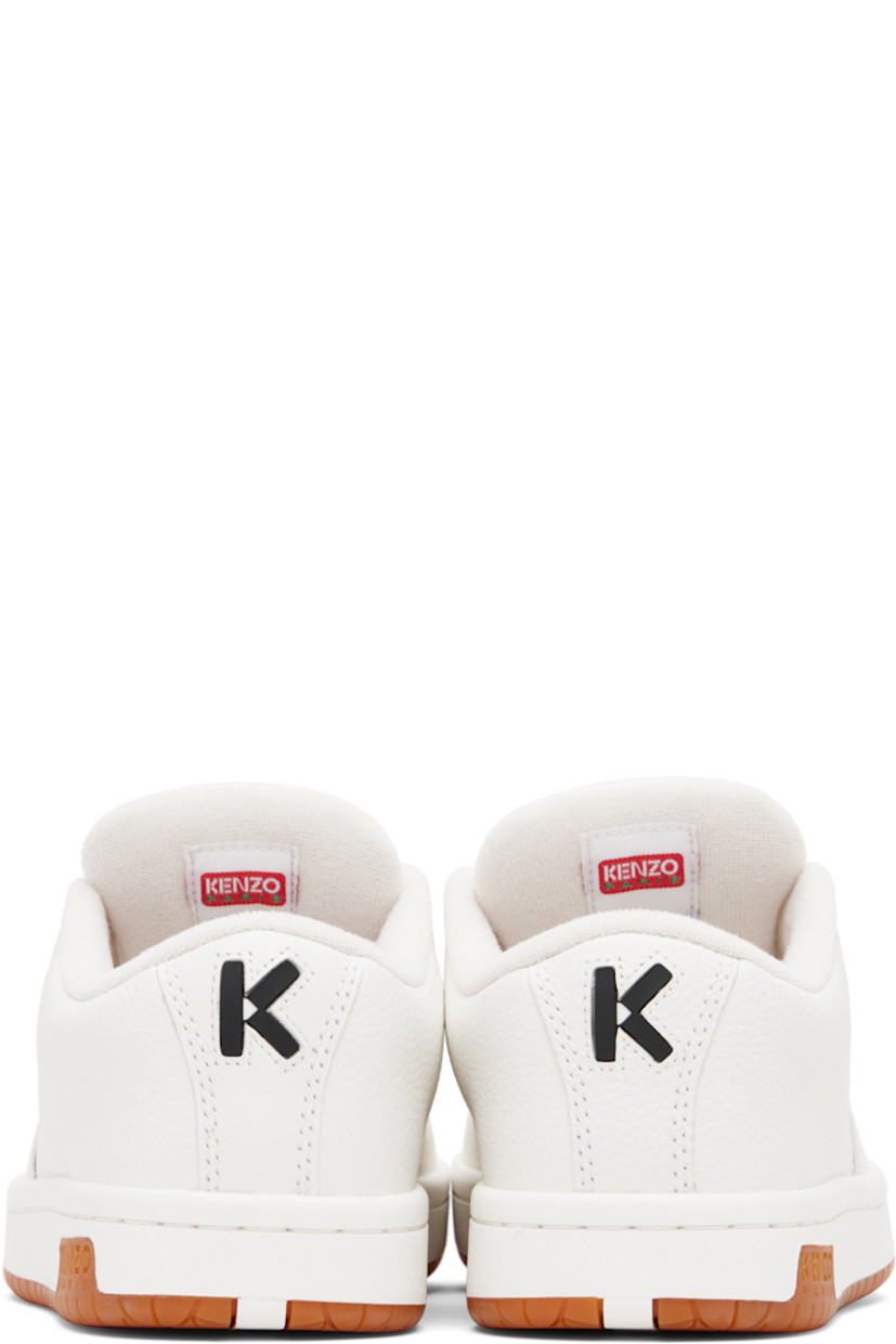 Low-top grained leather sneakers.

· Perforated detailing at toe and inner side
· Lace-up closure
· Rubberized logo patch at padded tongue
· Padded collar
· Logo appliqué at heel tab
· Terrycloth lining
· Treaded rubber sole
· Includes alternate laces in blue

Supplier color: Off white