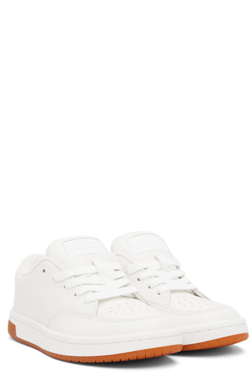 Low-top grained leather sneakers.

· Perforated detailing at toe and inner side
· Lace-up closure
· Rubberized logo patch at padded tongue
· Padded collar
· Logo appliqué at heel tab
· Terrycloth lining
· Treaded rubber sole
· Includes alternate laces in blue

Supplier color: Off white