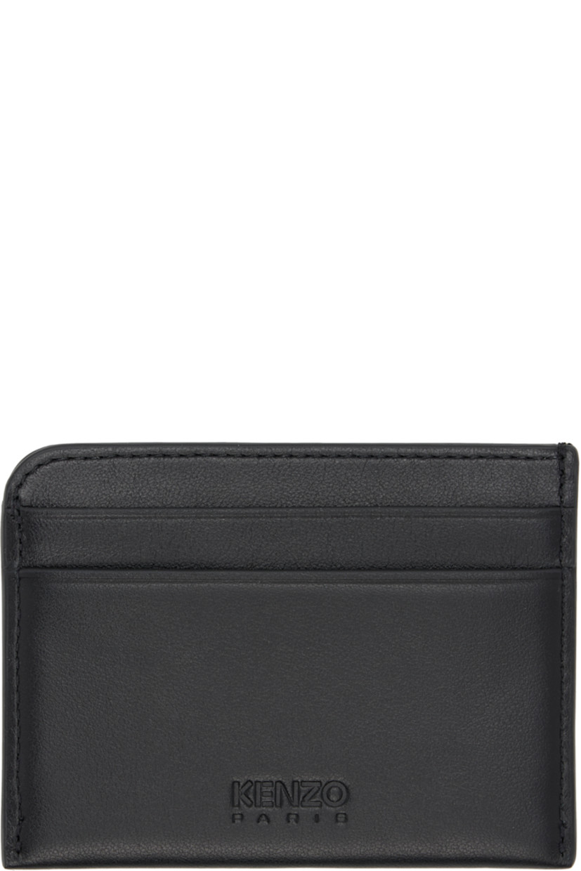 Buffed leather card holder. 

· Logo graphic printed at face
· Logo embossed at back face
· Four card slots 
· Central note slot 
· Twill lining
· H3" x W4"

Supplier color: Black