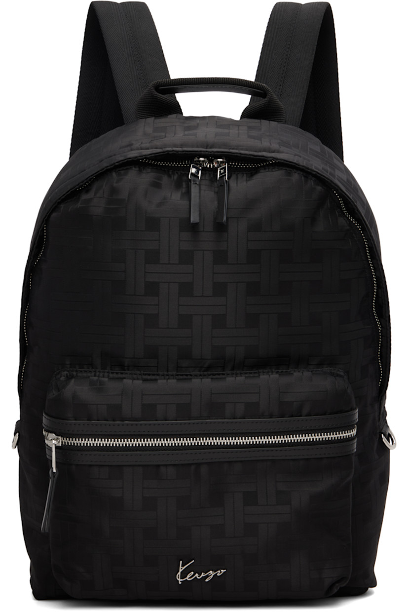 Canvas backpack.

· Jacquard graphic pattern throughout
· Fixed carry handle
· Adjustable padded shoulder straps
· Zip pocket and logo hardware at face
· D-ring at sides
· Two-way zip closure
· Laptop compartment at interior
· Twill lining
· H17" x W15" x D6.5"

Supplier color: Black