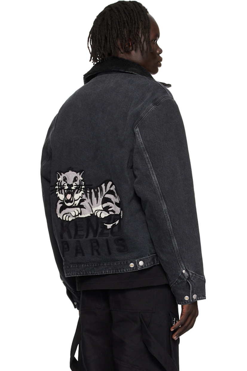 Stretch denim jacket.

· Fading throughout
· Sherpa fleece trim at spread collar
· Two-way zip closure
· Logo embroidered at chest
· Welt pockets at front
· Adjustable press-stud barrel cuffs
· Logo graphic embroidered at back
· Adjustable press-stud tabs at back hem
· Patch pocket at interior
· Full sherpa fleece lining

Supplier color: Stone bleached black