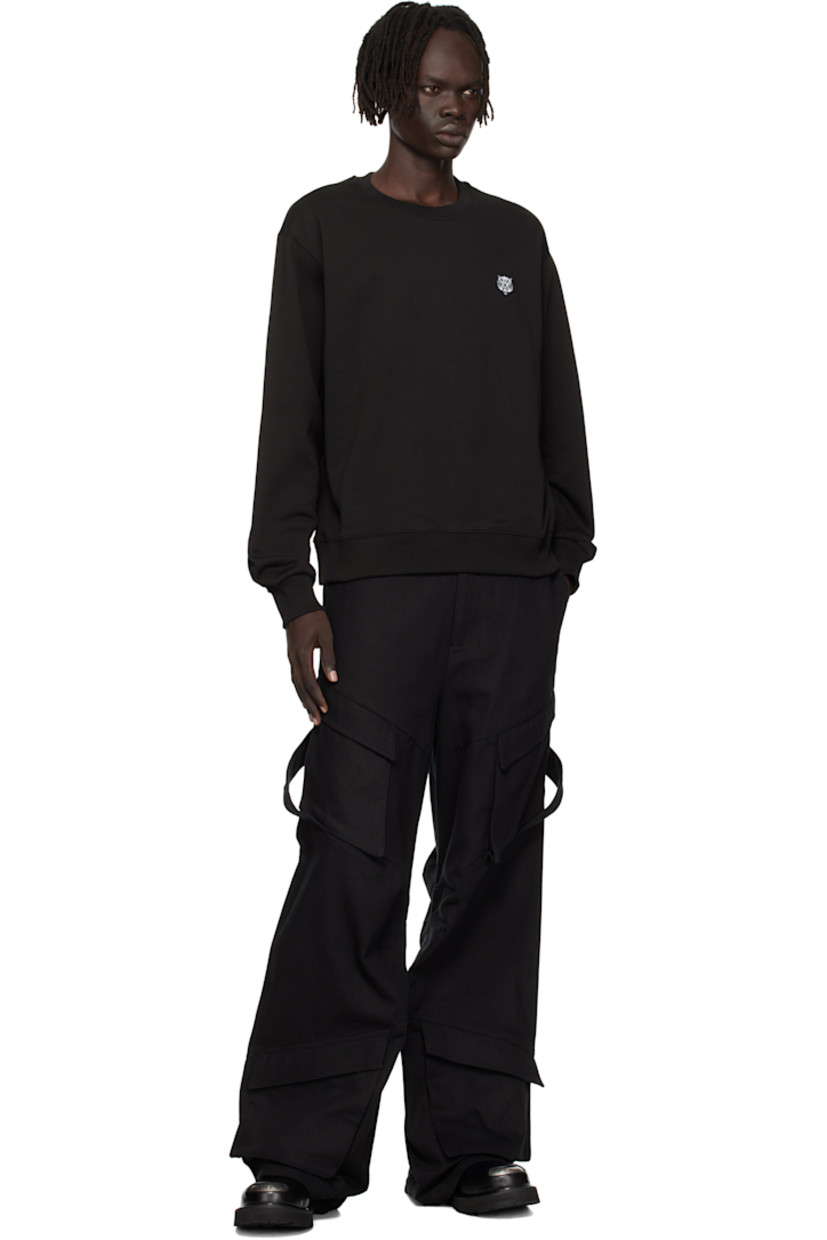 GOTS-certified organic cotton French terry sweatshirt.

· Rib-knit crewneck, hem, and cuffs 
· Embroidered graphic patch at chest
· Logo embroidered at back collar

Supplier color: Black