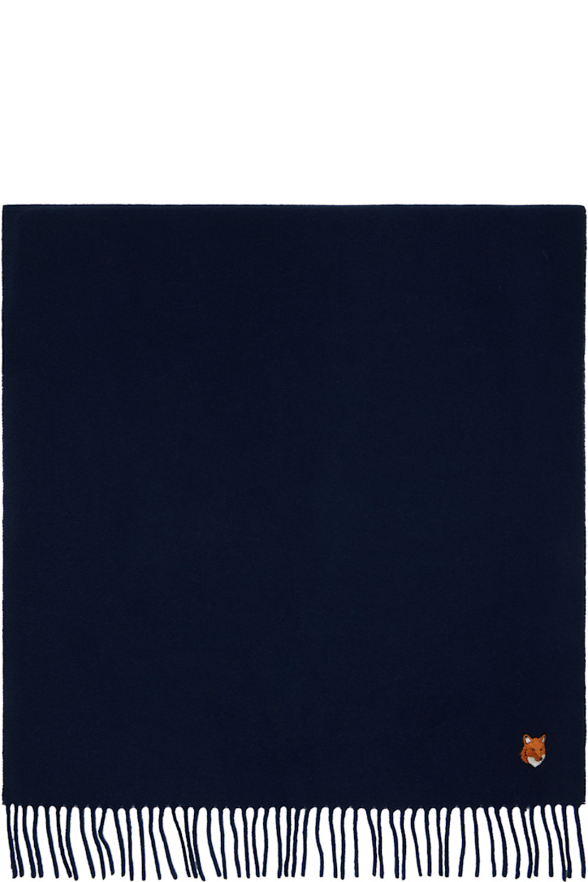 Rectangular and double-faced woven virgin wool scarf.

· Embroidered logo patch at end
· Fringed detailing at ends
· L78" x W23"

Supplier color: French navy