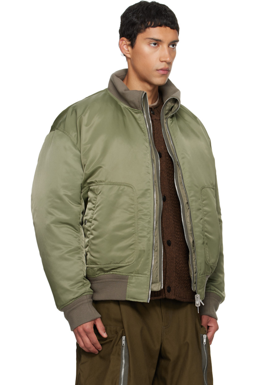 Reversible down-filled nylon satin bomber jacket 

Reverse in green quilted nylon satin. 

· Layered construction 
· Rib-knit stand collar, hem, and cuffs
· Two-way zip closure 
· Welt pocket at waist
· Dropped shoulders
· Utility pocket and pen slots at sleeve

Supplier color: Army green

Fill: 80% goose feather, 20% duck feather.
