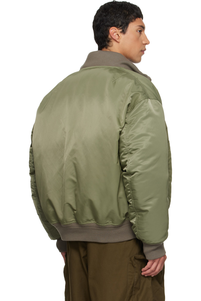Reversible down-filled nylon satin bomber jacket 

Reverse in green quilted nylon satin. 

· Layered construction 
· Rib-knit stand collar, hem, and cuffs
· Two-way zip closure 
· Welt pocket at waist
· Dropped shoulders
· Utility pocket and pen slots at sleeve

Supplier color: Army green

Fill: 80% goose feather, 20% duck feather.