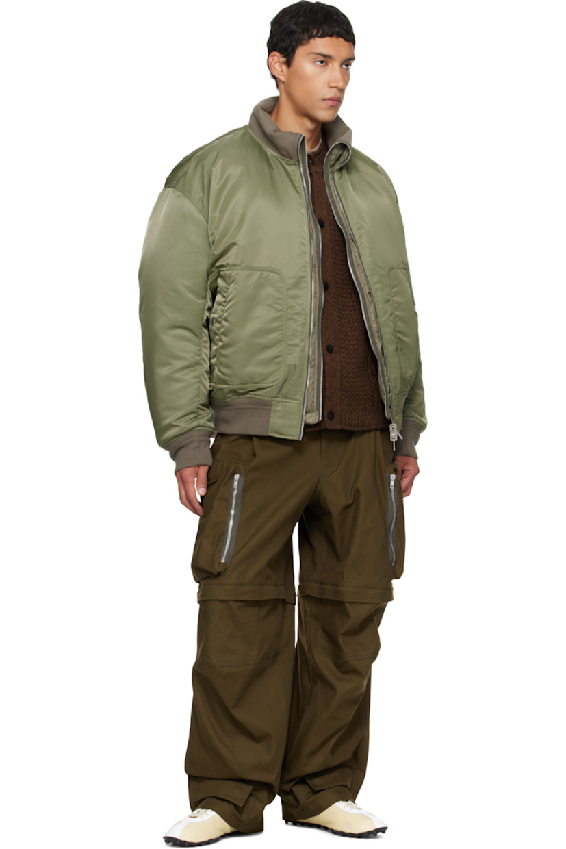 Reversible down-filled nylon satin bomber jacket 

Reverse in green quilted nylon satin. 

· Layered construction 
· Rib-knit stand collar, hem, and cuffs
· Two-way zip closure 
· Welt pocket at waist
· Dropped shoulders
· Utility pocket and pen slots at sleeve

Supplier color: Army green

Fill: 80% goose feather, 20% duck feather.