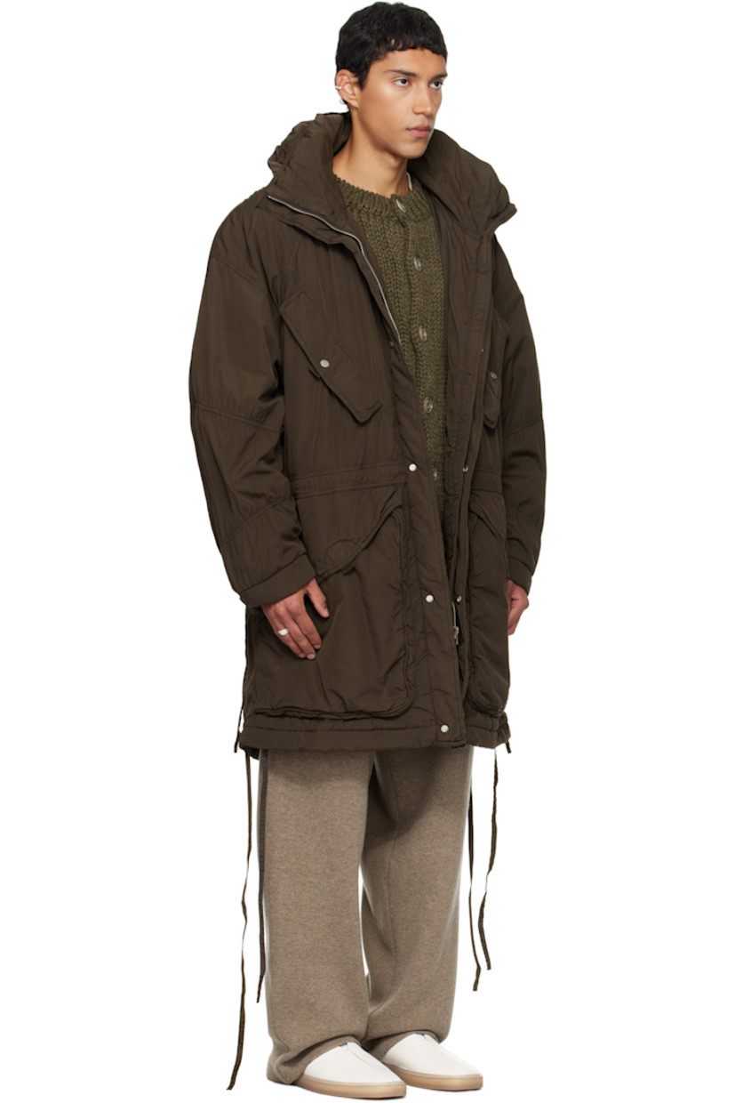Insulated cotton canvas coat.

· Layered construction
· Stowaway hood at stand collar 
· Concealed zip closure 
· Press-stud placket 
· Flap pockets at front
· Self-tie drawstring at waist
· Dropped shoulders
· Ruching at sleeves
· Press-stud barrel cuffs

Supplier color: Cocoa