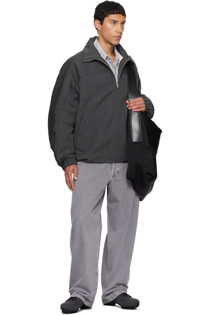 Padded virgin wool twill jacket.

· Stand collar
· Zip closure
· Press-stud welt pockets at waist
· Partially elasticized hem
· Yoke sleeves
· Elasticized cuffs
· Striped webbing strap at back collar
· Full satin twill lining

Supplier color: Concrete