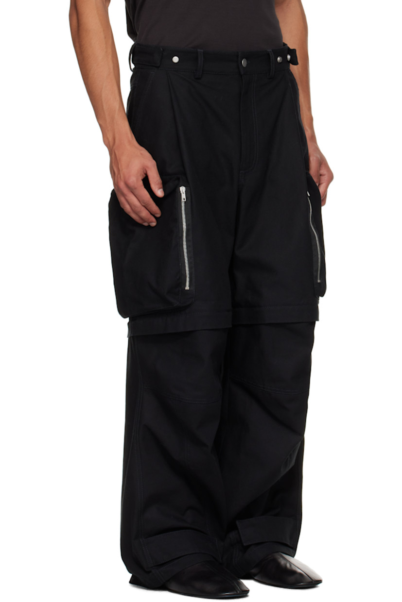 Cotton canvas cargo pants.

· Belt loops
· Adjustable press-stud tabs at waistband and hem
· Four-pocket styling
· Zip fly
· Pleats at waist
· Zip fastening at knees for shorts styling
· Zip cargo pocket at outseams
· Logo belt loops at back

Supplier color: Black