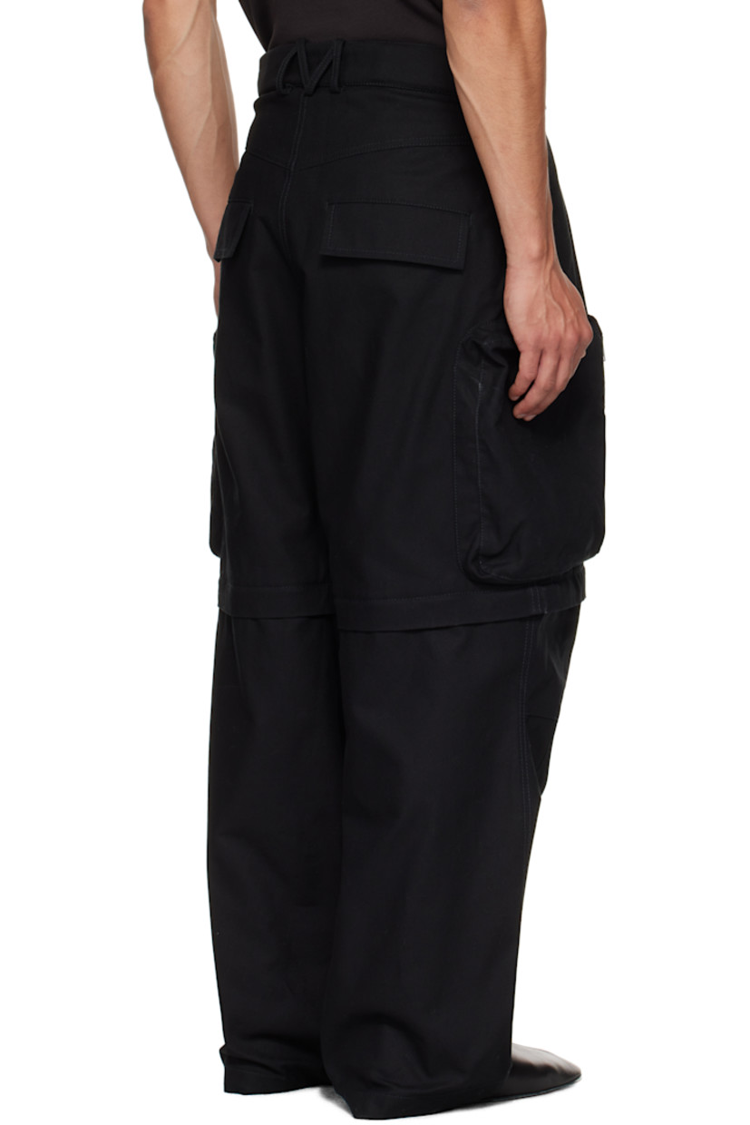 Cotton canvas cargo pants.

· Belt loops
· Adjustable press-stud tabs at waistband and hem
· Four-pocket styling
· Zip fly
· Pleats at waist
· Zip fastening at knees for shorts styling
· Zip cargo pocket at outseams
· Logo belt loops at back

Supplier color: Black