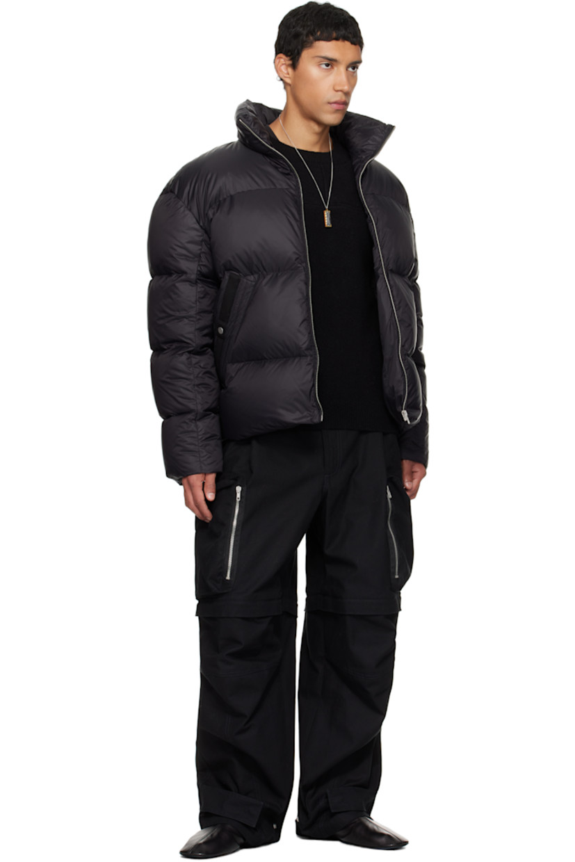 Cotton canvas cargo pants.

· Belt loops
· Adjustable press-stud tabs at waistband and hem
· Four-pocket styling
· Zip fly
· Pleats at waist
· Zip fastening at knees for shorts styling
· Zip cargo pocket at outseams
· Logo belt loops at back

Supplier color: Black