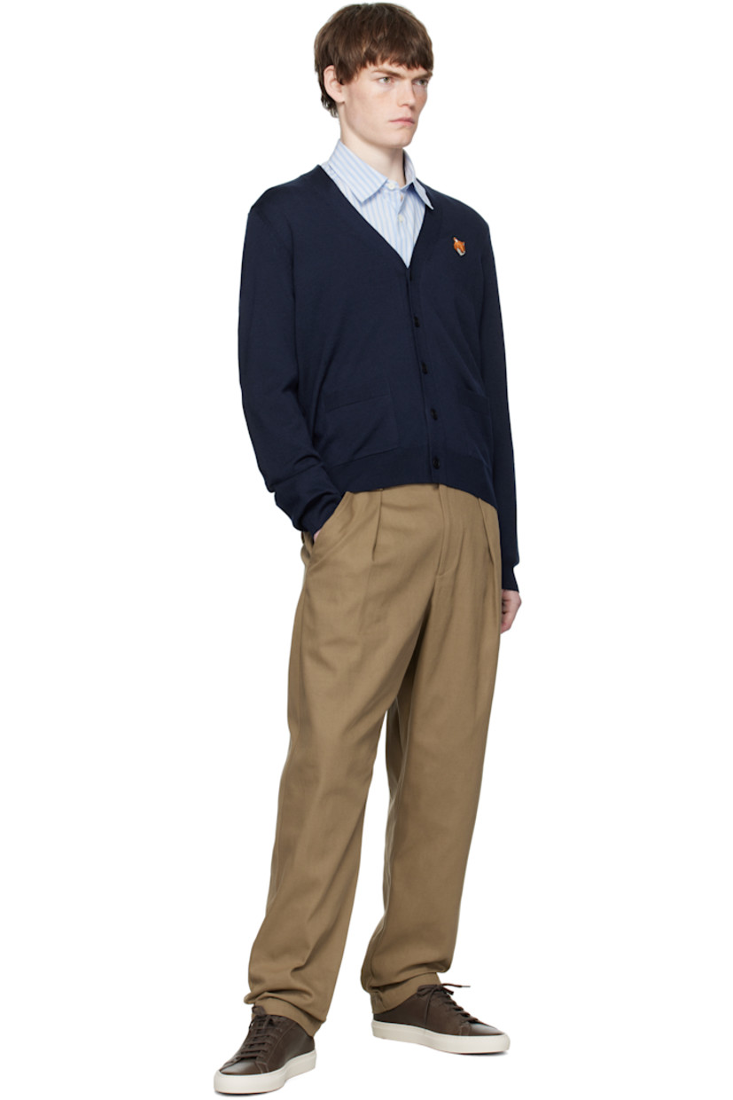 Knit wool cardigan.

· V-neck
· Button closure
· Logo patch embroidered at chest
· Rib-knit cuffs and hem
· Patch pockets at waist

Supplier color: Classic Navy
