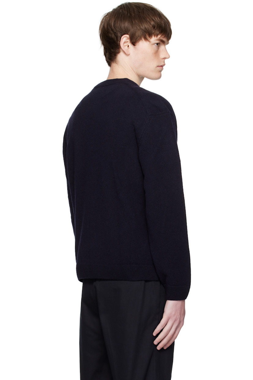 Knit lambswool sweater.

· Rib-knit crewneck, cuffs, and hem
· Logo patch embroidered at chest 

 Supplier color: Classic Navy