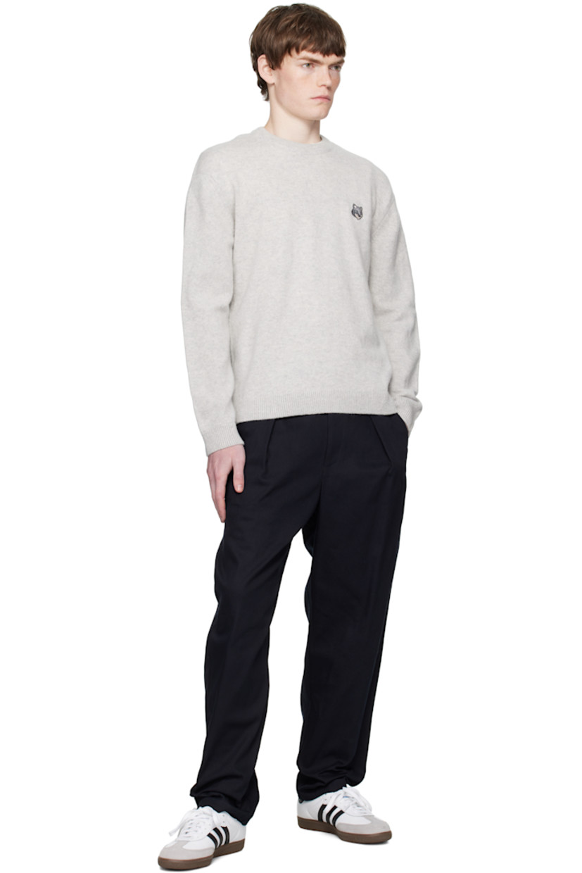 Knit wool sweater.

· Rib-knit crewneck, hem, and cuffs
· Embroidered logo patch at chest
· Dropped shoulders

Supplier color: Light grey melange