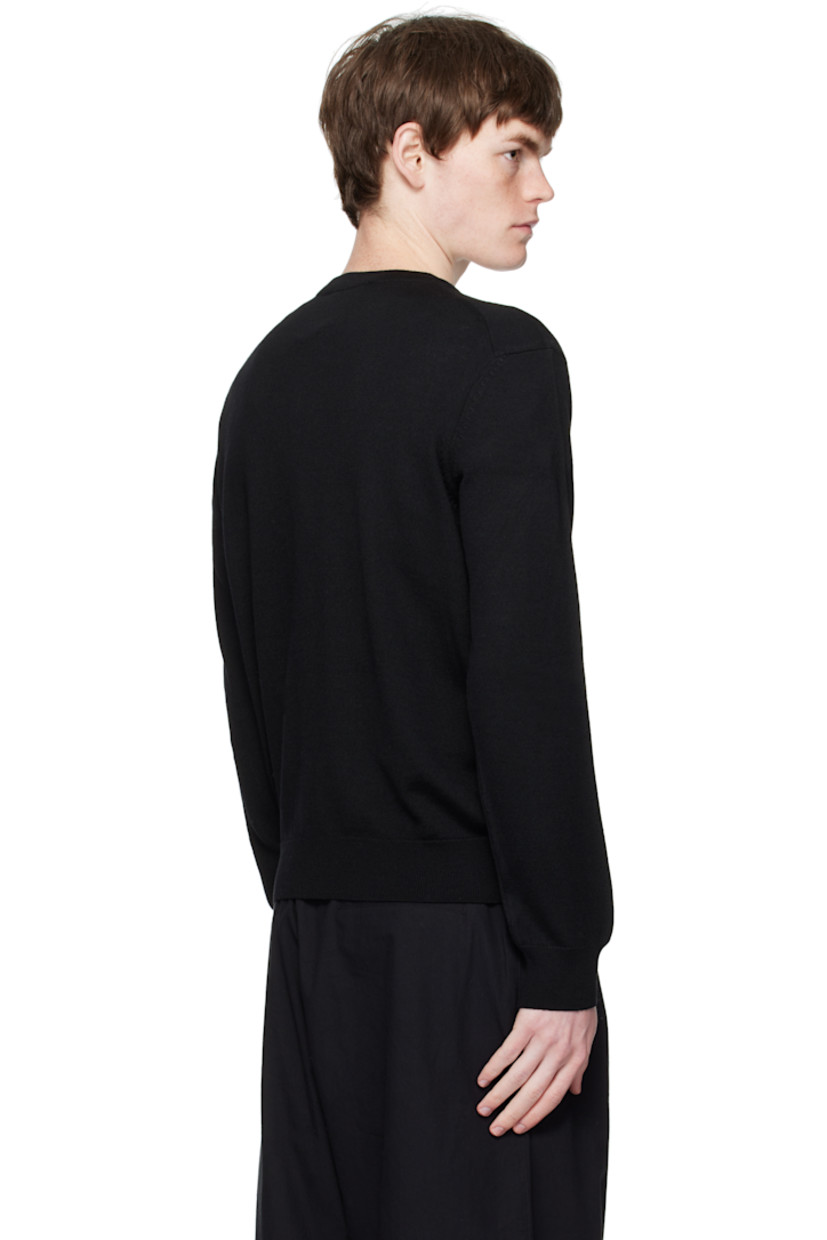 Knit wool sweater.

· Rib-knit crewneck, cuffs, and hem 
· Logo patch embroidered at chest

Supplier color: Black