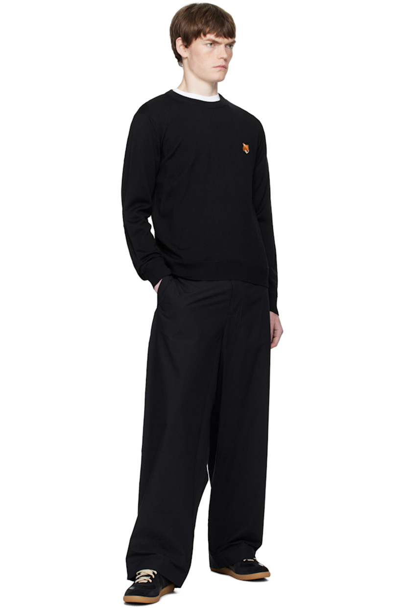 Knit wool sweater.

· Rib-knit crewneck, cuffs, and hem 
· Logo patch embroidered at chest

Supplier color: Black