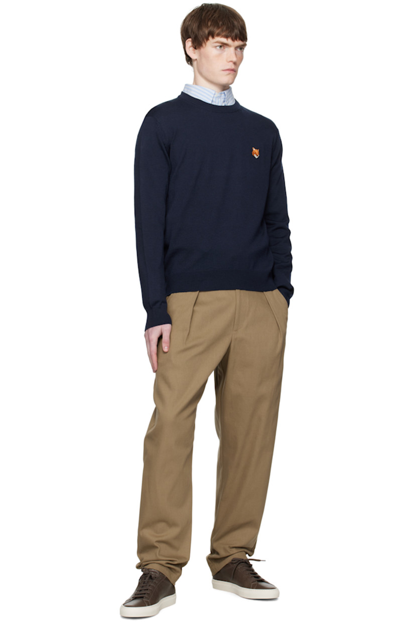 Knit wool sweater.

· Rib-knit crewneck, cuffs, and hem
· Logo patch embroidered at chest

Supplier color:  Classic Navy