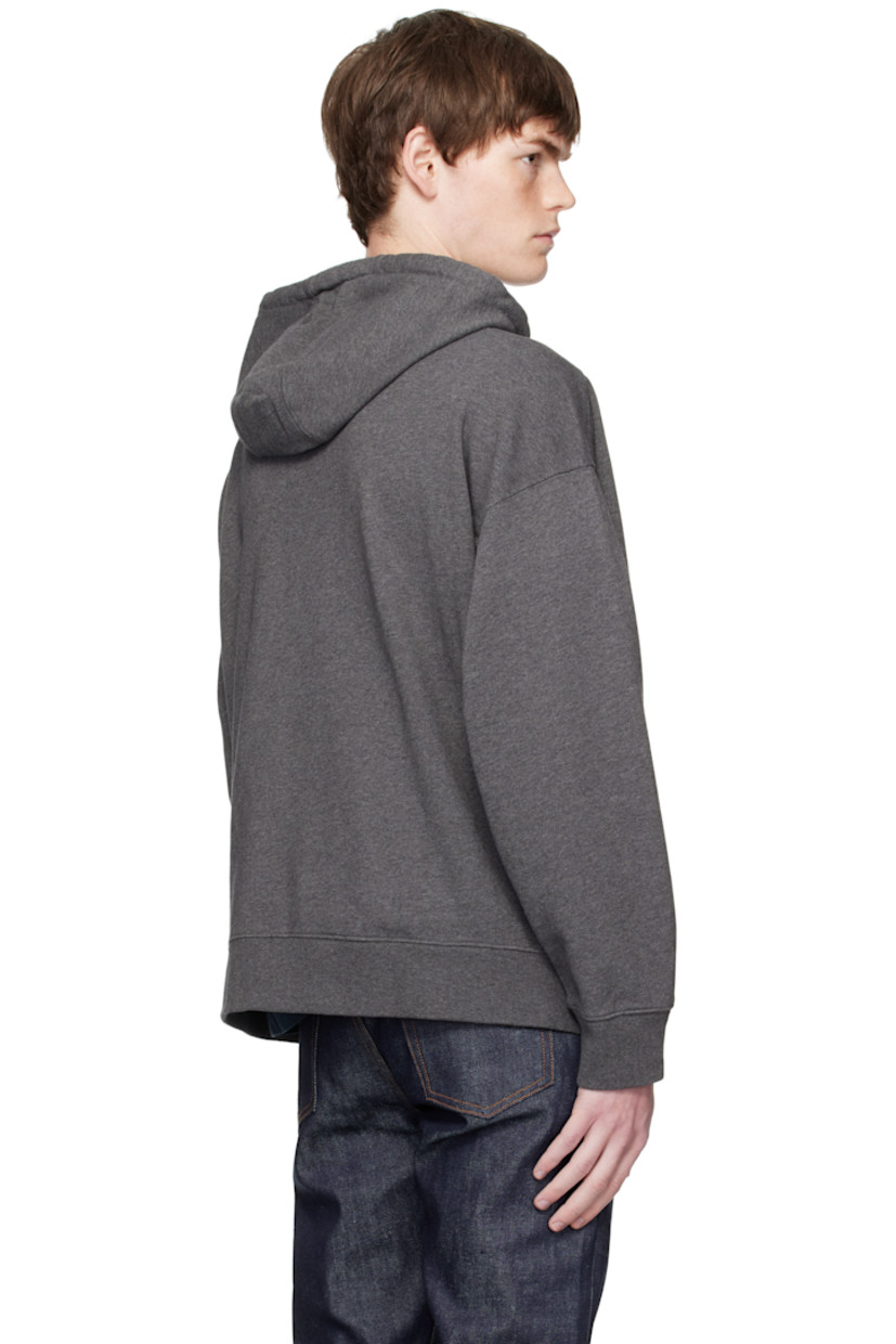 Cotton french terry hoodie.

· Drawstring at hood
· Zip closure
· Logo patch embroidered at chest 
· Welt pockets at waist 
· Rib-knit hem and cuffs
· Logo-engraved silver-tone hardware

Supplier color: Dark Grey Melange