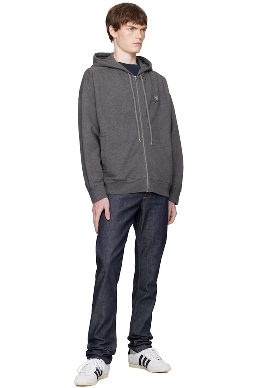 Cotton french terry hoodie.

· Drawstring at hood
· Zip closure
· Logo patch embroidered at chest 
· Welt pockets at waist 
· Rib-knit hem and cuffs
· Logo-engraved silver-tone hardware

Supplier color: Dark Grey Melange