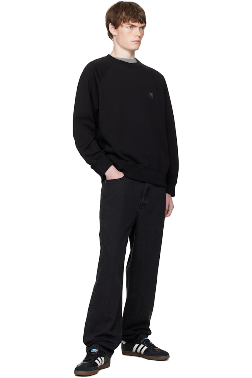 Cotton French terry sweatshirt.

· Rib-knit crewneck, cuffs, and hem
· Logo patch embroidered at chest
· Raglan sleeves

Supplier color: Black