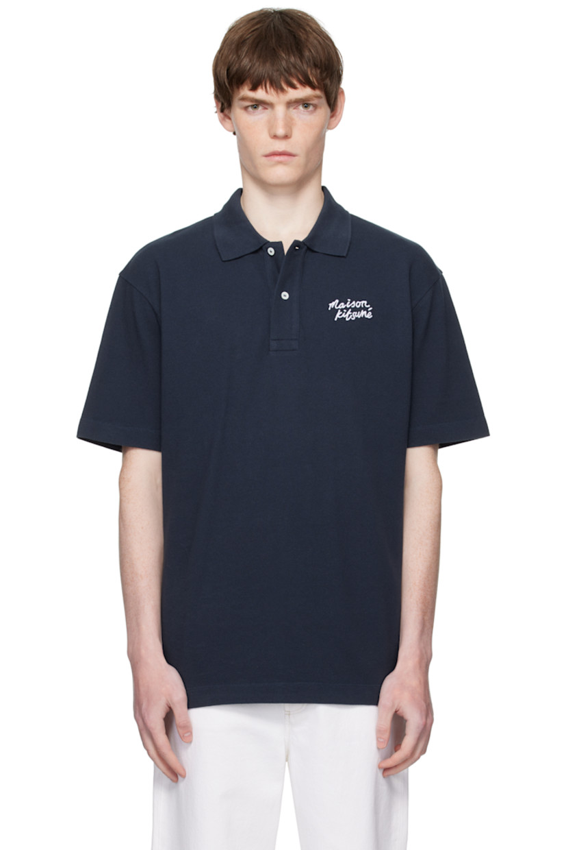 Cotton piqué polo.

· Rib-knit spread collar
· Two-button placket
�· Logo embroidered at chest
· Tennis-tail hem

Supplier color: Classic Navy