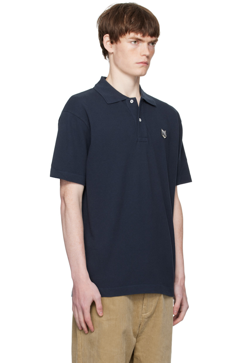 Cotton piqué polo. 

· Rib-knit spread collar
· Two-button placket
· Logo patch embroidered at chest
· Tennis-tail hem

Supplier color: Classic Navy