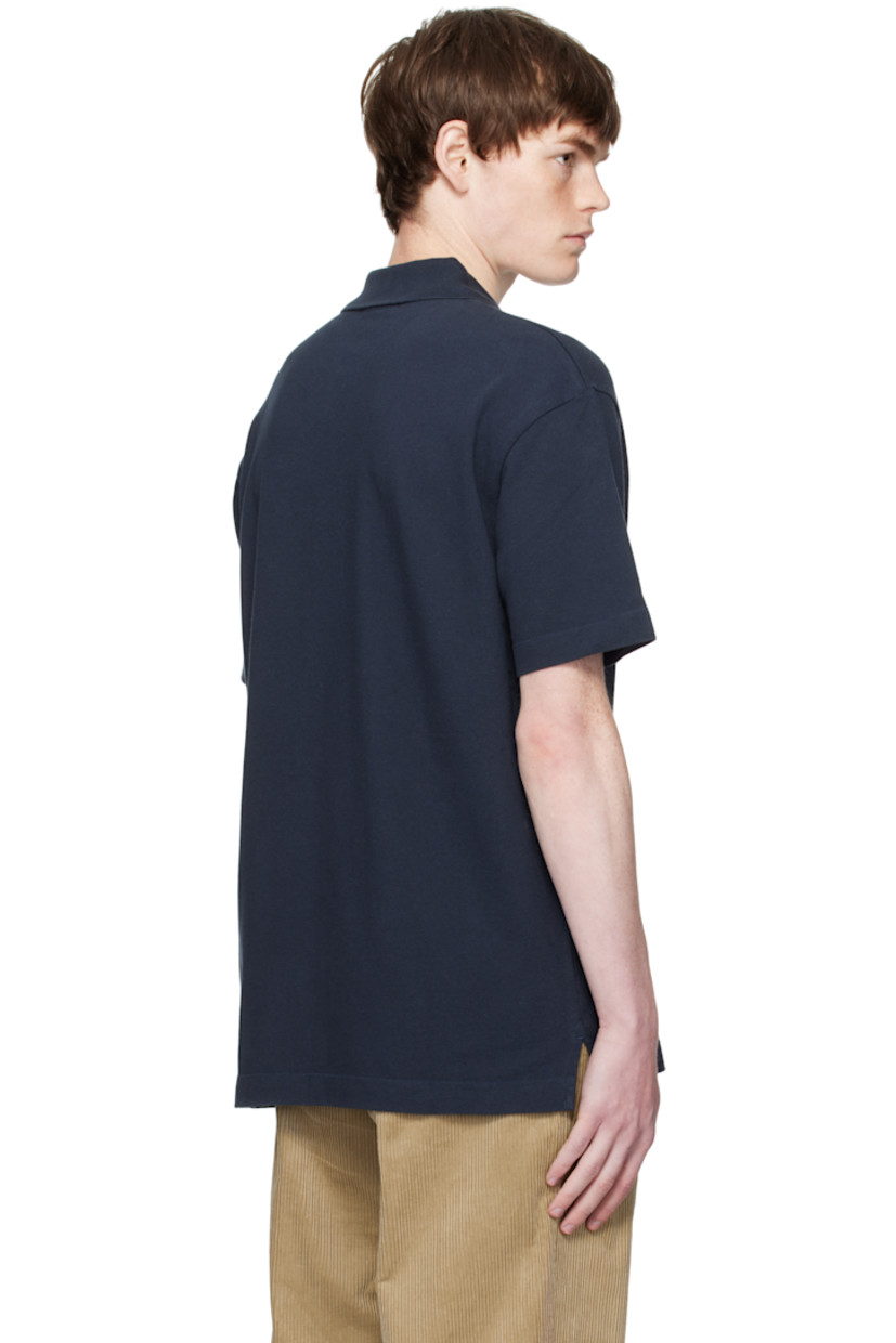 Cotton piqué polo. 

· Rib-knit spread collar
· Two-button placket
· Logo patch embroidered at chest
· Tennis-tail hem

Supplier color: Classic Navy