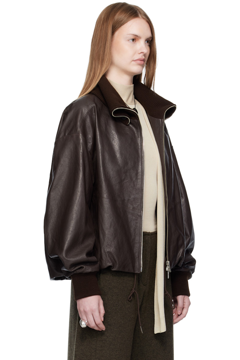 Vegetable-dyed grained lambskin jacket.

· Rib-knit spread collar and cuffs
· Two-way zip closure
· Welt pockets
· Concealed drawstring at hem
· Dropped shoulders
· Welt pocket at interior
· Full satin lining

Supplier color: Brown