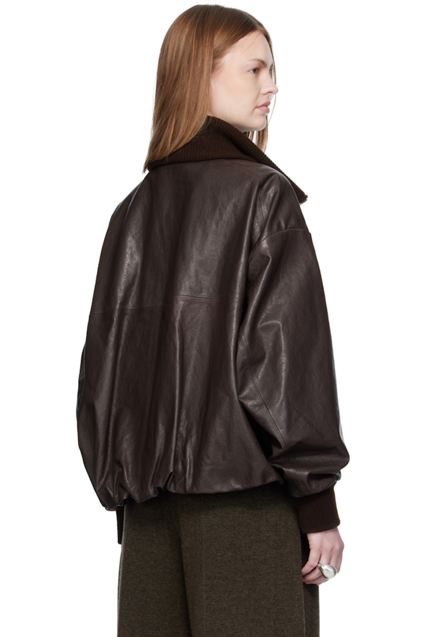 Vegetable-dyed grained lambskin jacket.

· Rib-knit spread collar and cuffs
· Two-way zip closure
· Welt pockets
· Concealed drawstring at hem
· Dropped shoulders
· Welt pocket at interior
· Full satin lining

Supplier color: Brown