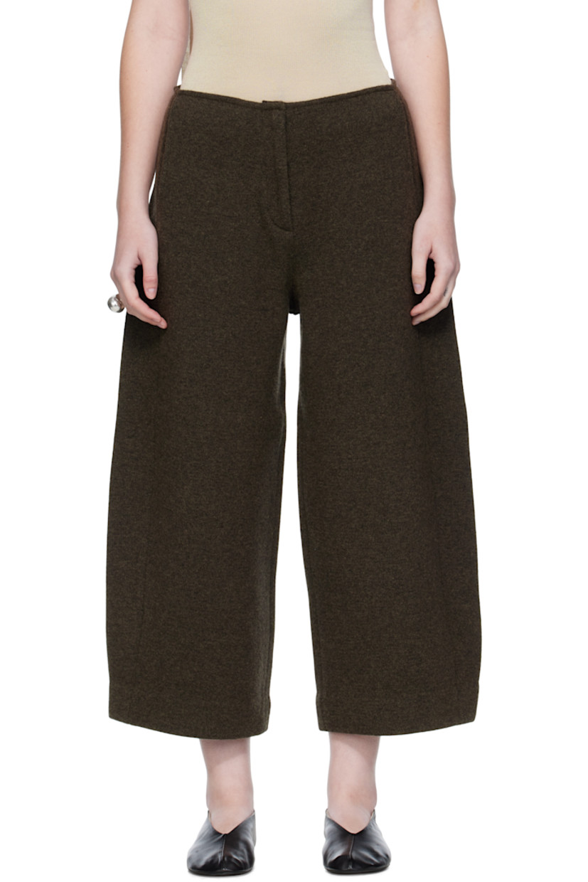 Knit wool-blend trousers.

· Two-pocket styling
· Zip fly
· Mock pockets at back
· Central crease at back legs

Supplier color: Dark olive